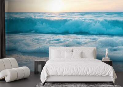 Foamy waves softly embrace the shore as the sun sets, creating a tranquil, picturesque beach scene. Wall mural