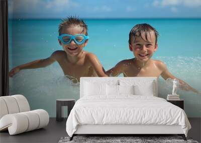 Two happy children playfully splash in the turquoise ocean, enjoying a carefree beach day. Wall mural