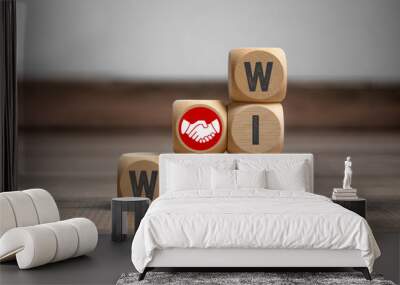 Cubes and dice with handshake icon and win-win-situation on wooden background Wall mural