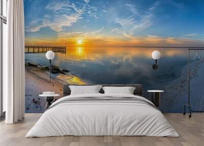 serene sunrise over the shore with straight beach pier extends into the ocean, tranquil beauty of coastal landscapes  Wall mural