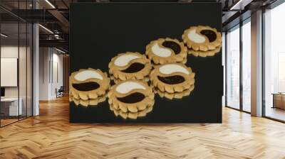 Cookies with white and dark chocolate on a black background Wall mural