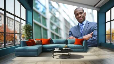 african business man keeping arms crossed Wall mural