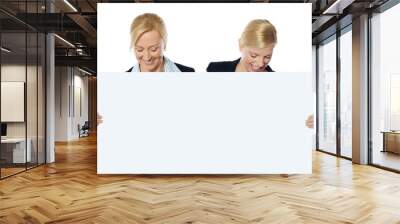 female business executives looking at blank banner ad Wall mural