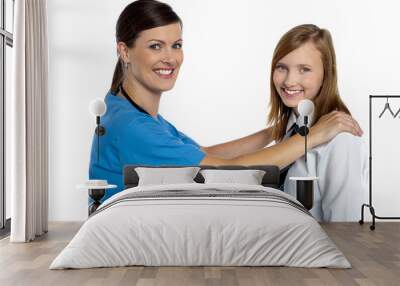 Friendly female doctor with her patient Wall mural