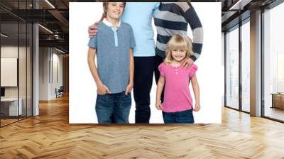 Smiling young couple with their children Wall mural