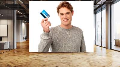 smiling young man holding credit card Wall mural