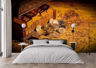 Vintage treasure box full of gold bars and coins on world map. Discovery concept Wall mural