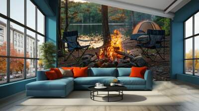 A beautiful bonfire with burning wood next to chairs and a camping tent in the forest. Camping. Vacation. Holidays. Rest. Wall mural