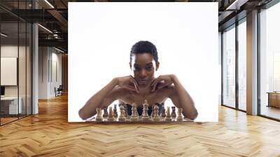 Beautiful woman playing chess and looking at camera Wall mural