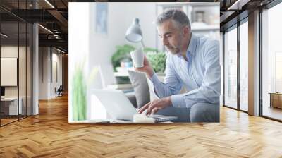 Businessman having a coffee break Wall mural