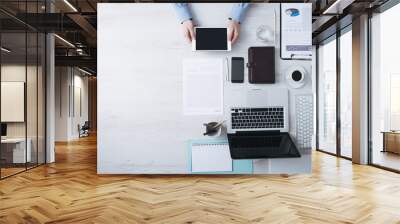 Businessman working at desk with a digital tablet Wall mural