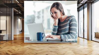 busy woman working with her laptop Wall mural