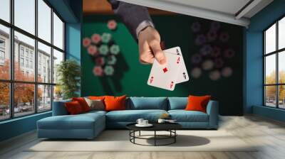 Poker player holding two aces Wall mural