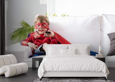 Superhero boy watching tv Wall mural