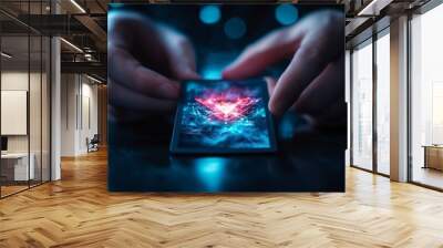 Hands holding a smartphone with a glowing futuristic hologram, symbolizing digital technology and innovation in a dark background. Wall mural