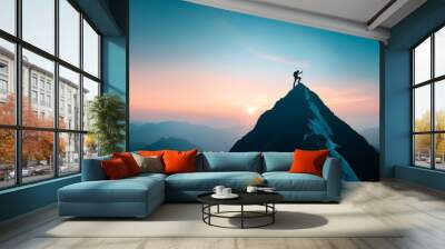 Silhouette of a person standing on a mountain peak at sunrise, embodying adventure, achievement, and the beauty of nature. Wall mural