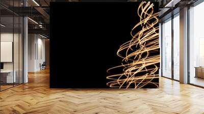 Christmas greeting card template with illuminated light trails  swirled and rotated on long exposure in shape of Christmas tree.  Wall mural