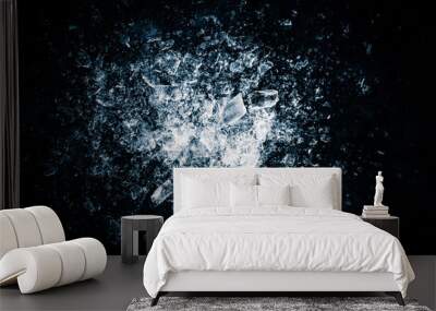 Ice, crushed on a black background. Shards of crushed ice spreading away. The explosion of ice. Wall mural