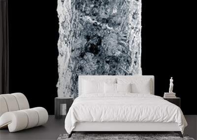 Solid textured natural ice block with cracks on a black reflective surface. Wall mural