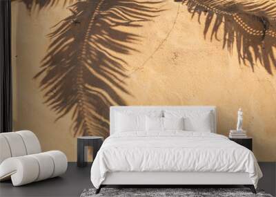 Tropical beach sand with shadows of coconut palm tree leaves. Travel and vacations concept background. Wall mural