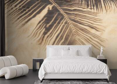 Tropical beach sand with shadows of coconut palm tree leaves. Travel and vacations concept background. Wall mural