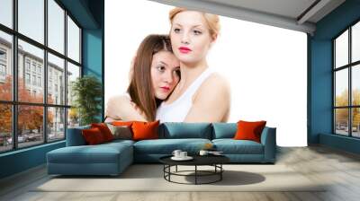 Two beautiful women friends closeup face portrait Wall mural