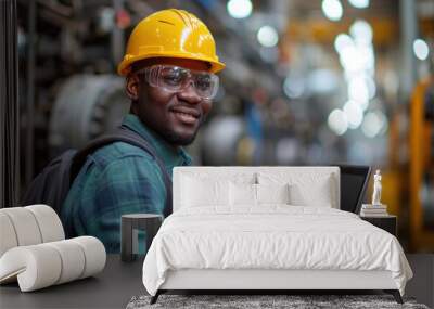 Manufacturing Factory black male Mechanical Engineer Works on Personal Computer at Metal lathe industrial manufacturing factory. Engineer Operating lathe Machinery. African people. Wall mural