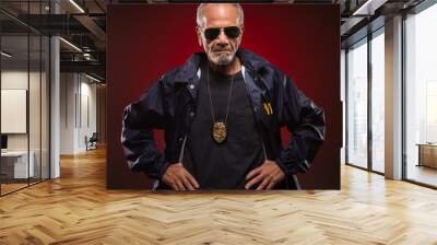 Mature special agent wearing a badge, with his hands on his waist. Wall mural