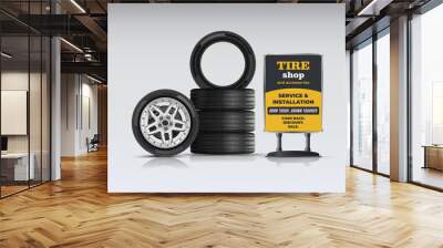 Tire set. Maintenance and installation. Side view of a car tire with an alloy wheel, caliper and brake disc. Portable billboard. Stack of rubber wheels. Wheel shop. Discounts, promotions. Wall mural