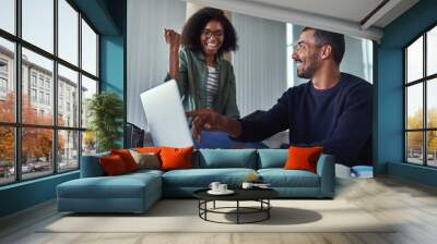 Cheerful young businesswoman celebrating their success Wall mural