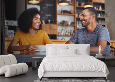 Happy young couple sitting in cafe Wall mural