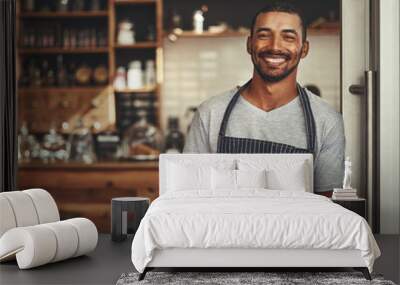 Portrait of a male owner holding digital tablet in his cafe Wall mural