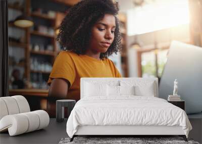 Young woman working on her laptop Wall mural