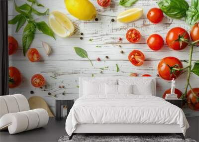 Healthy food ingredients composition with fresh cherry tomatoes, herbs, garlic cloves, lemon wedges and spoon on white wooden rustic background, overhead shot with copy space Wall mural