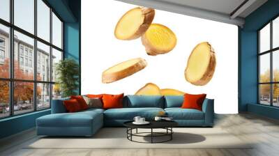 a group of sliced ginger root pieces falling down on a transparent background Wall mural