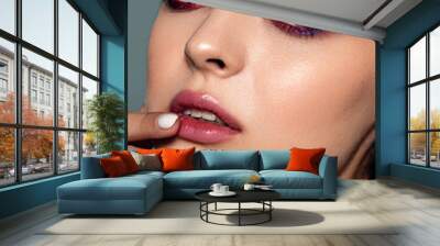 Close-up portrait of a beautiful woman with evening makeup. Strong skin texture. Natural skin, clean healthy skin. Wall mural