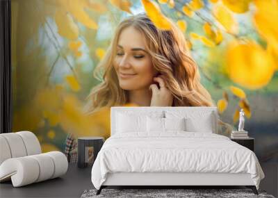 Outdoor atmospheric lifestyle photo of young beautiful lady. Blond hair and eyes. Warm autumn. Warm spring Wall mural