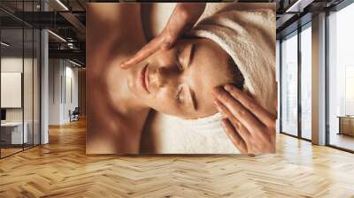 Close-up of young woman getting spa massage treatment at beauty spa salon. Cosmetology beauty skin care anti-aging treatment rejuvenation. Body care, spa Wall mural