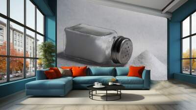 A pile of salt from salt shaker, concept excessive salt intake and white death Wall mural