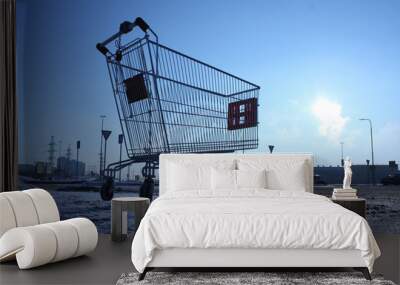 image of empty shopping cart on empty parking near huge store Wall mural