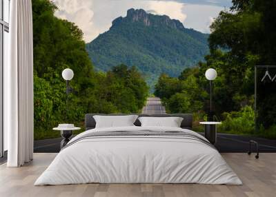 Bumpy asphalt road on hill in Lampang Thailand Wall mural