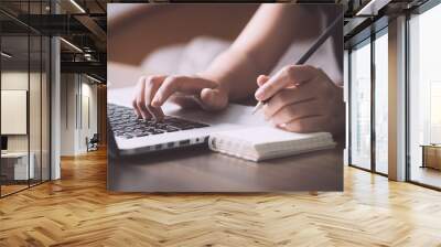 Female writing information on paper in workplace. office concept Wall mural