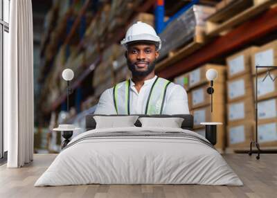 Portrait of African warehouse manager standing in a large distribution center. concept of career and occupation. Wall mural