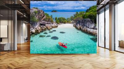 Aerial drone view of in kayak in crystal clear lagoon sea water during summer day near Koh Lipe island in Thailand. Travel tropical island holiday concept Wall mural