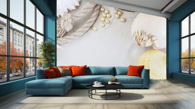 vacation concept/several sea shells, rope, barometer on a white sand top view and copy space Wall mural