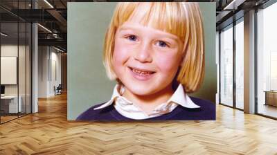 Vintage 1978 yearbook school image of a smiling young girl with blond hair and blue eyes with blue sweater and white blouse. Wall mural