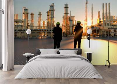 Technicians supervisor looking out onto an oil refinery at sunset with pipes and steel 3d render Wall mural