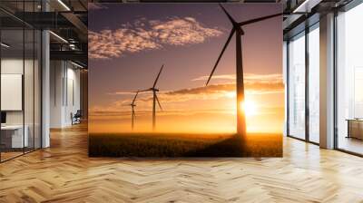 Three commercial wind turbines in thick fog at sunrise in the English countryside panorami Wall mural