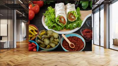 Cig kofte (raw meatball in Turkish) with lettuce, tomato, pickle and lemon, hot Chee kofta Wall mural