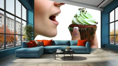 closeup of woman eating chocolate cupcake Wall mural